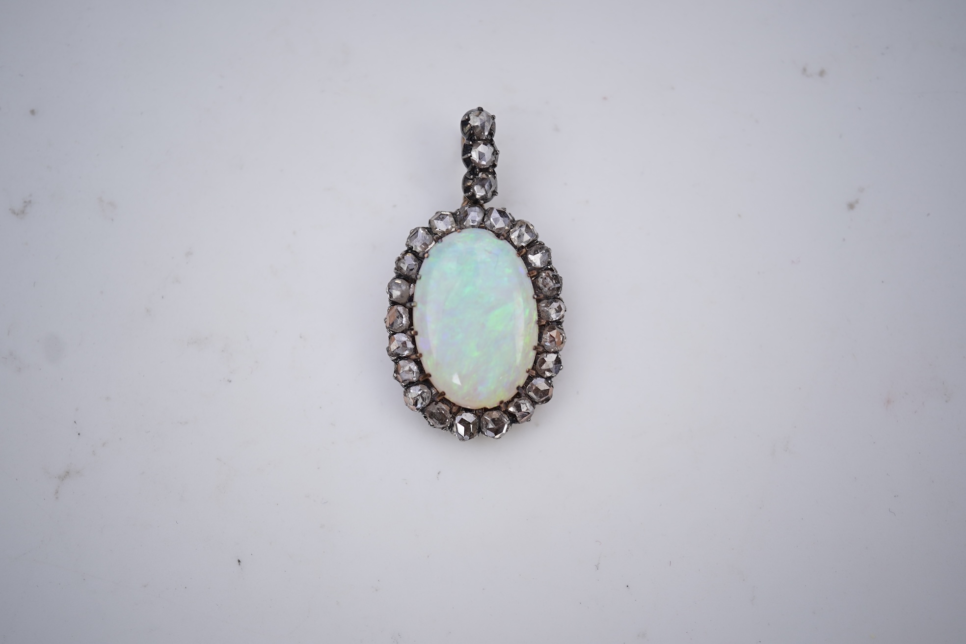 An opal and diamond pendant, early 20th century